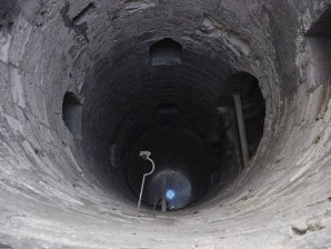 Dead Lowered On Ropes Down Spiral Staircase. Catacombs Or ( Kom es-Shogafa ), Alexandria, Egypt. Travels & Tours. Pictures, Photos, Images, Descriptions, Information, & Reviews.
