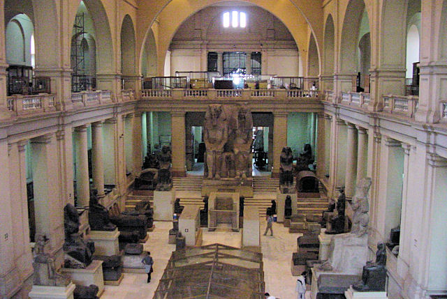 The Great Hall, Statue Of Amenemhet III & His Family In The Background, Egyptian Museum, Cairo, Egypt. Travels & Tours. Pictures, Photos, Images, Descriptions, Information, & Reviews.