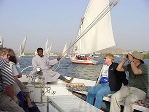 Audrey DeLange On Felucca  Sailing Boat, Nile River, Aswan, Egypt. Travel & Tour Pictures, Photos, Images, Descriptions, Information, & Reviews.